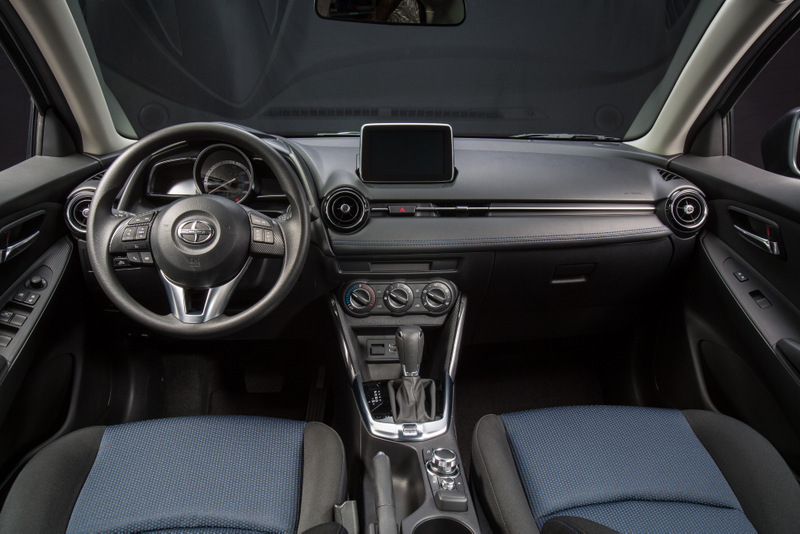 2016 Scion iA sedan manual interior standard 7-in display rotary controller Mazda2